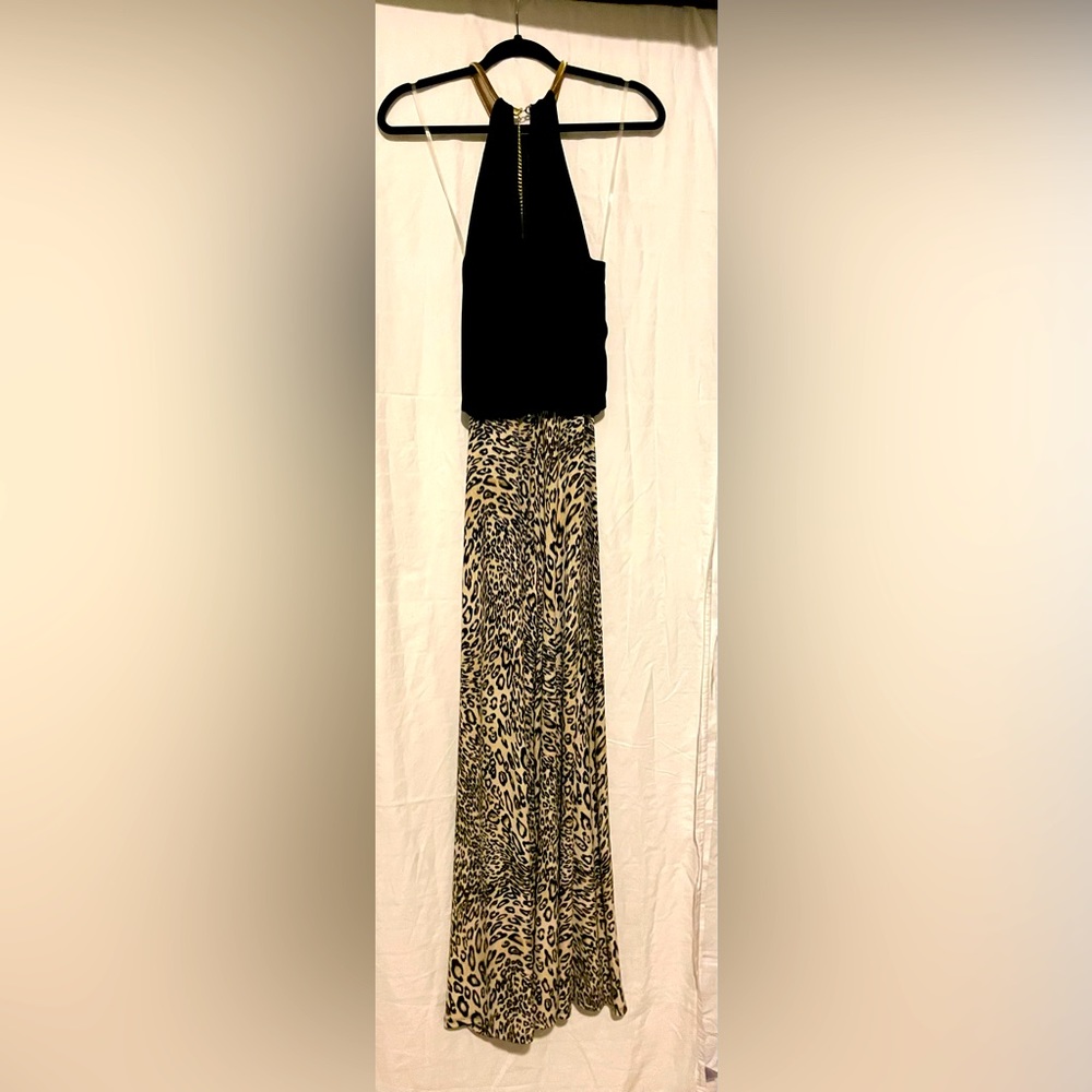 Gold chain around the neck jump suit. Flared leg